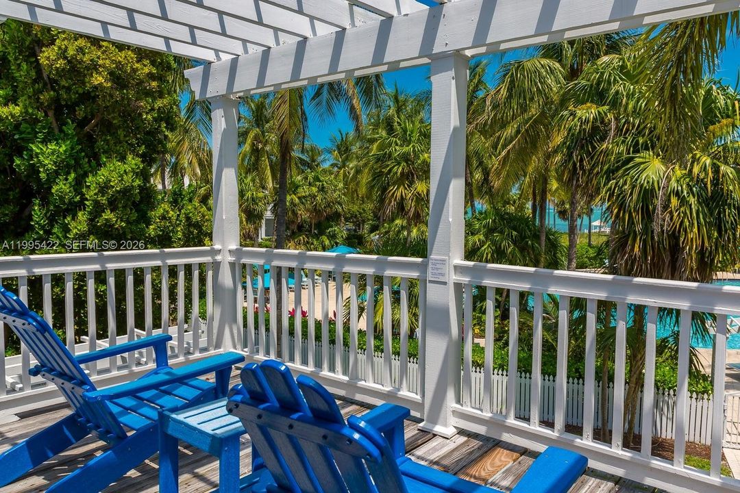 Off living room leads to pool and beach