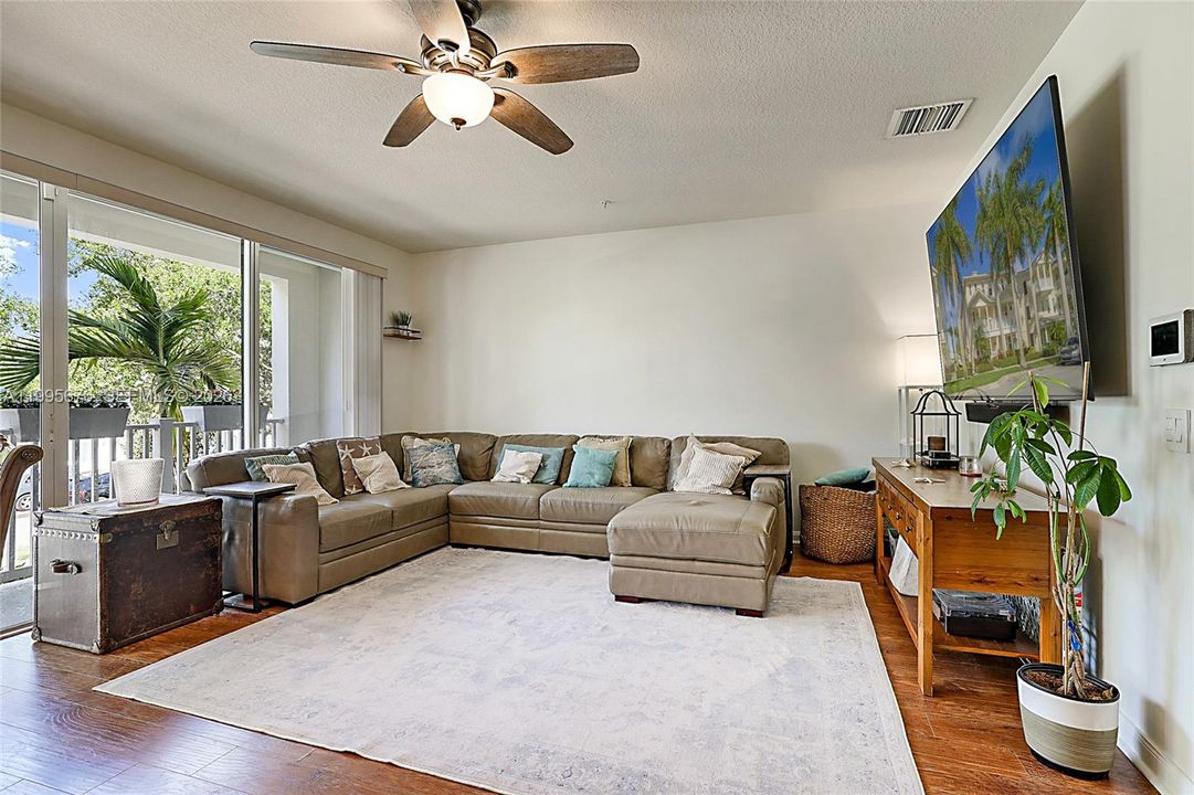 Open floor plan with balcony doors