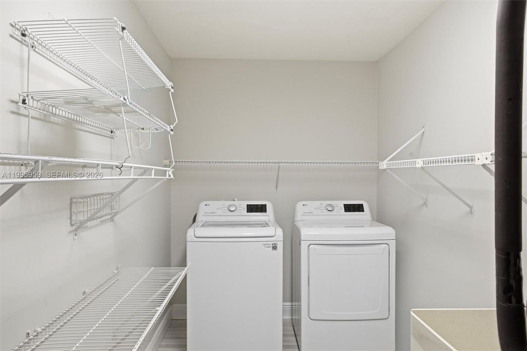 Ample Laundry with Wash Tub and Shelves
