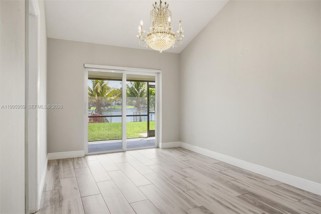Dining Area with Chandelier & Lake View