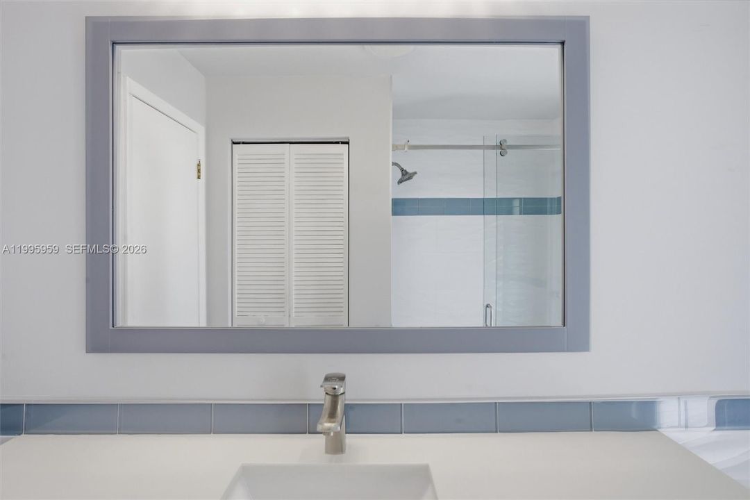 2nd Bathroom Very Nice Solid Counter and Framed Mirror