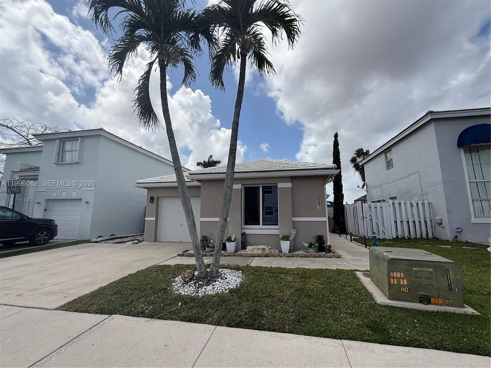 Exterior Front w/wider driveway.
