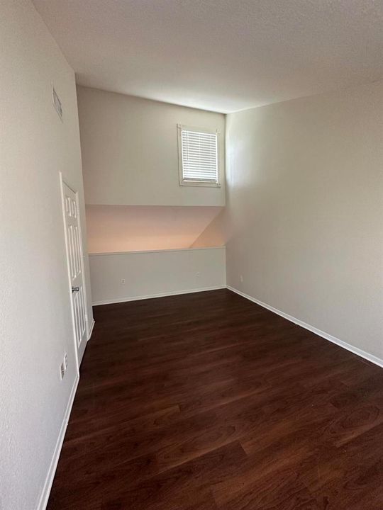 Upstairs bedroom looking at loft opening