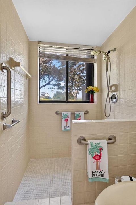 Shower with sweeping fairway views.