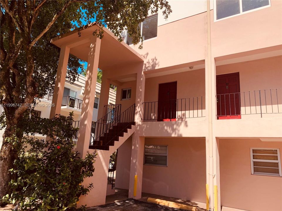 Stairs to unit, first door.
