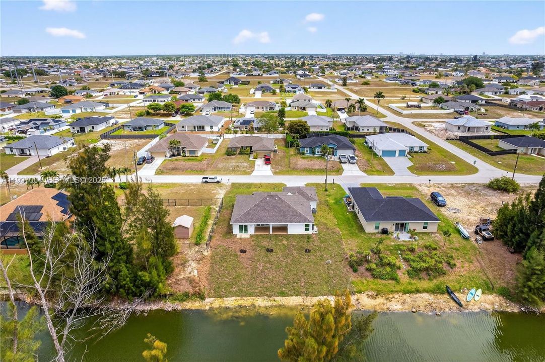 Set on a WEST-REAR EXPOSURE freshwater canal, this property delivers breathtaking sunset views and a peaceful waterfront setting perfect for kayaking, relaxing, or simply embracing Florida’s outdoor lifestyle.