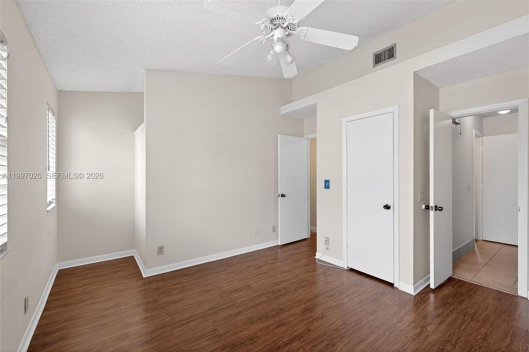 Primary bedroom with walk in closet