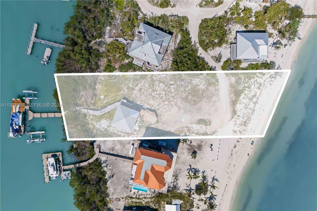 Small guest home remains and is sold as-is. This is a rare property offering Bay to Gulf access with deep waters and multiple boat lifts!