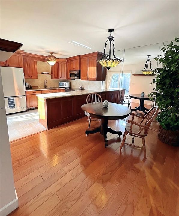 Entryway looking into kitchen and dining area