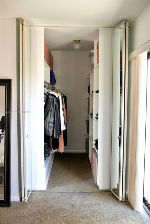 Primary Closet with built in shelving