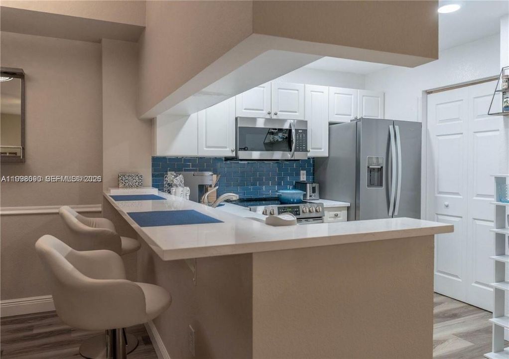Open kitchen overlooking dining and living areas