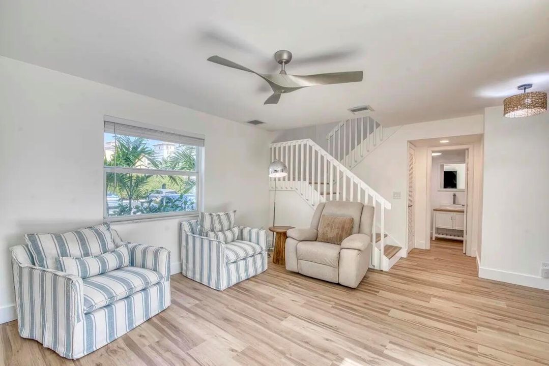 Living Room with Stairs (Staged)