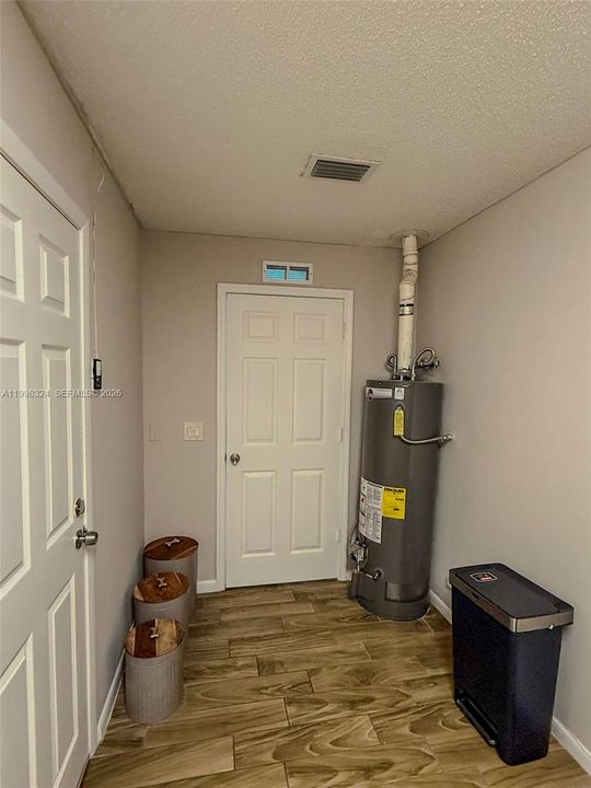 large laundry room off the Garage