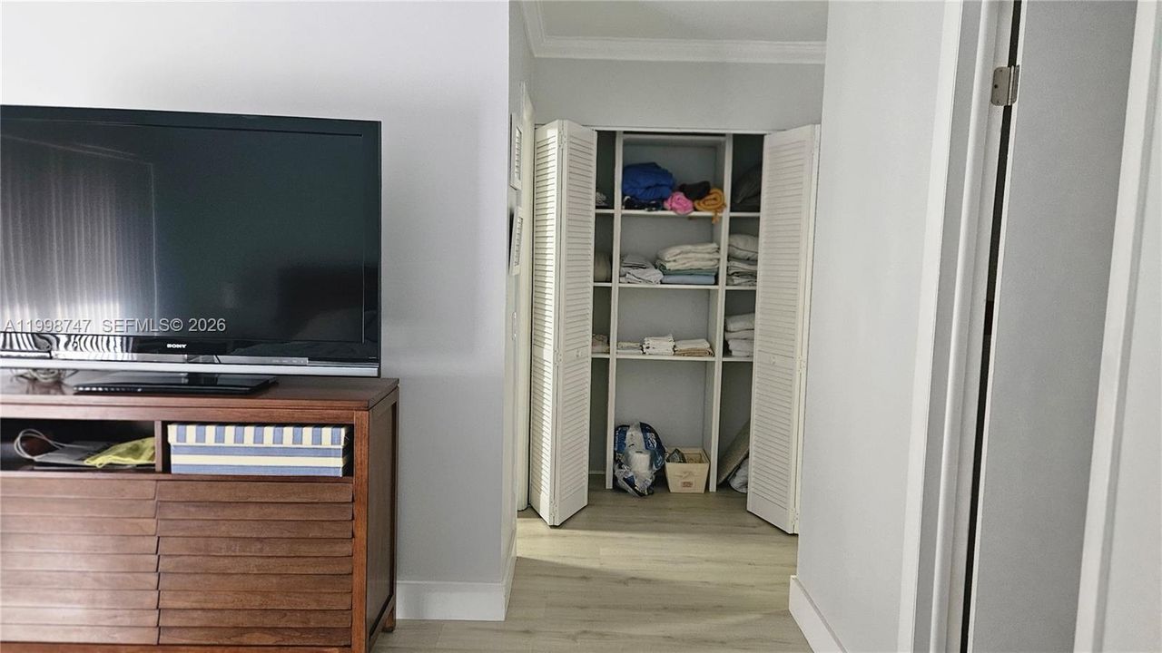 Linen Closet next to walking closet