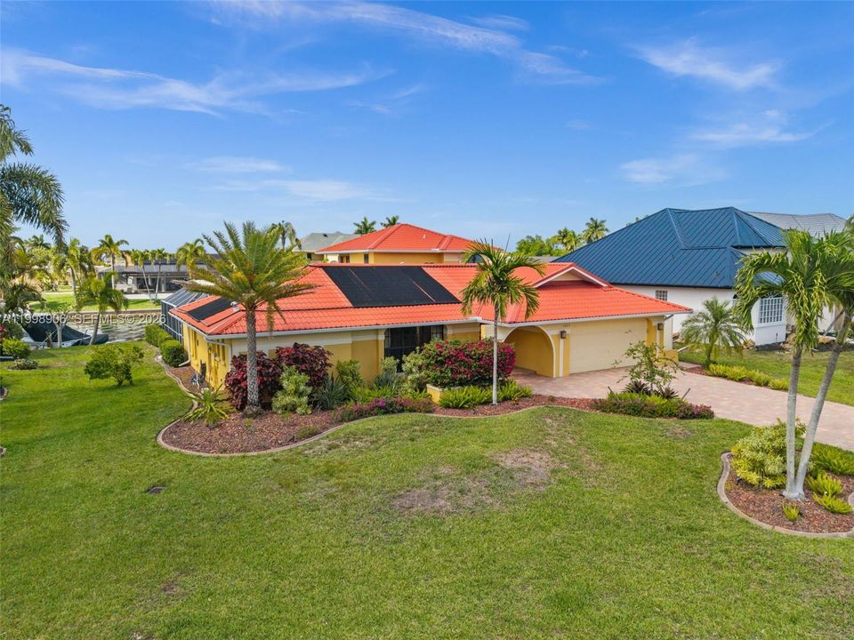 Lush Tropical Landscaping surrounds this remodeled 2 story home