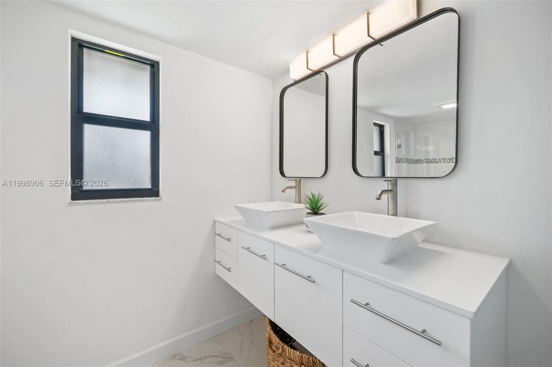 Main floor primary bath with dual sinks