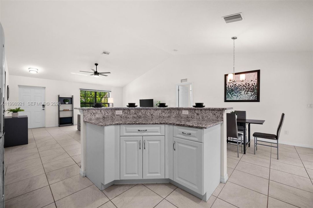 The island with breakfast bar is central to the main living area