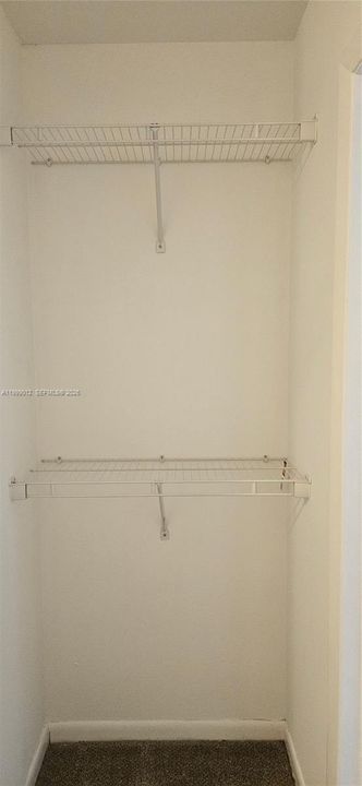 Walk in master bedroom closet