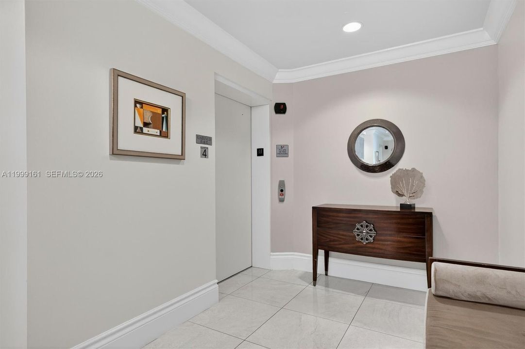 Elevator opens to private Foyer
