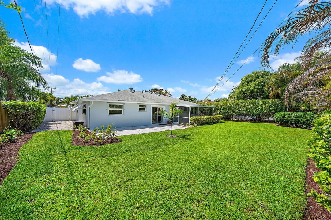 View of back of home and yard