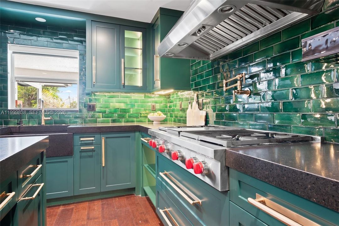 Custom chef's kitchen featuring Wolf gas range.