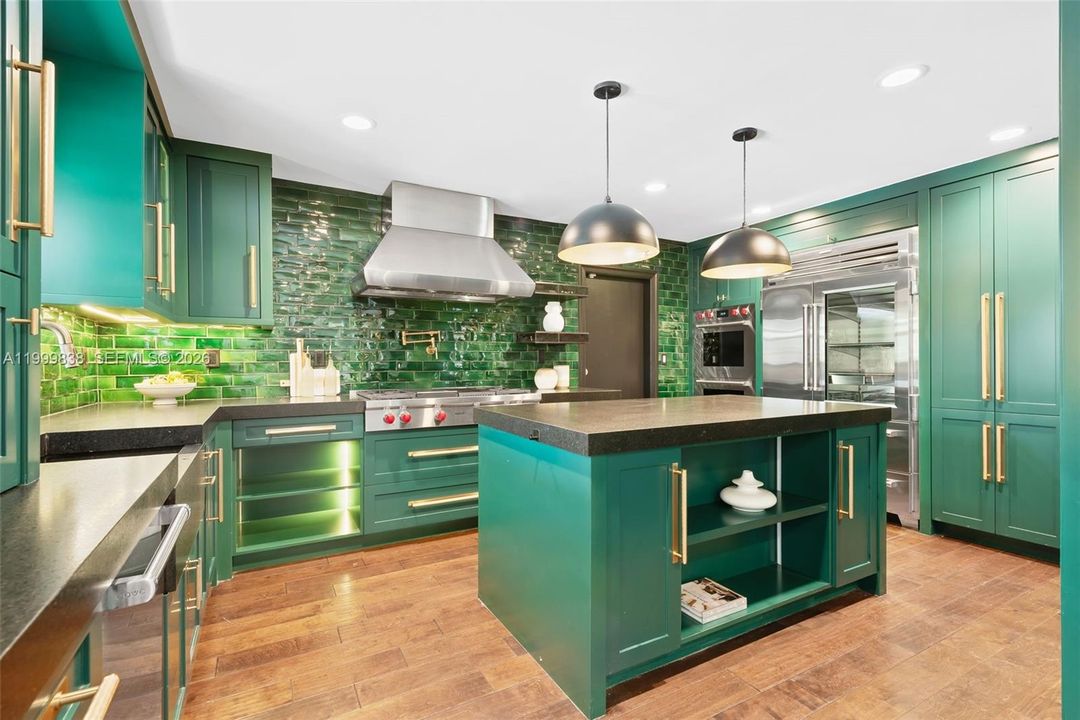 Custom chef's kitchen with Wolf gas range, Wolf & Sub Zero appliances