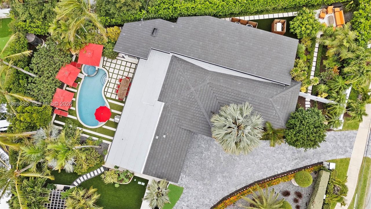 Aerial of 3001 Bayview featuring circular marble driveway, flat tile roof, and meticulously manicured grounds with several areas to enjoy the south Florida lifestyle. Other features include hot tub, sauna and outdoor shower.