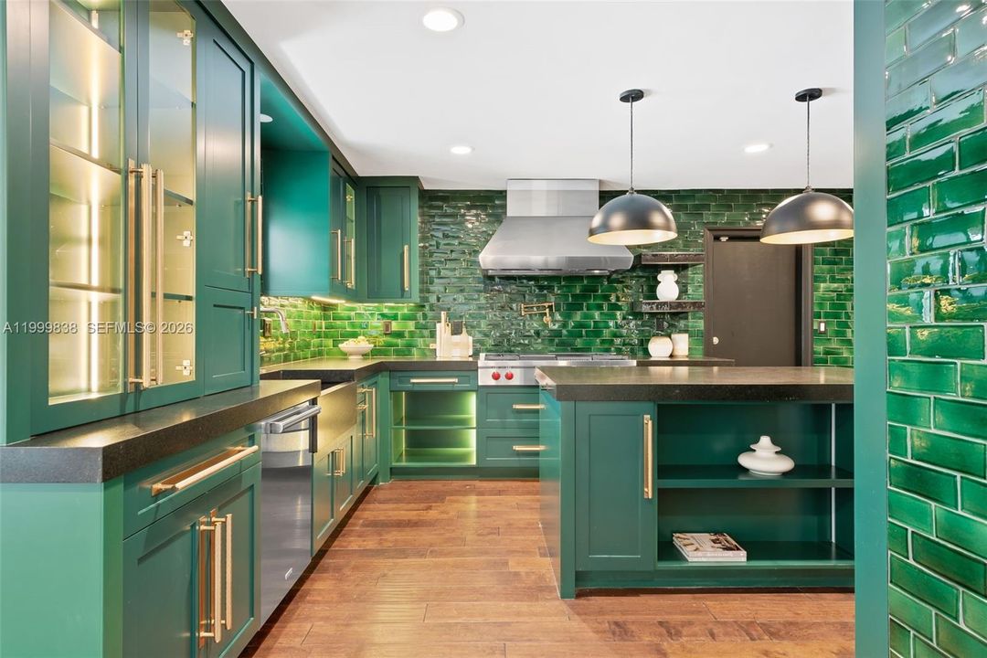 Expansive custom chef's kitchen with Wolf gas range & custom island