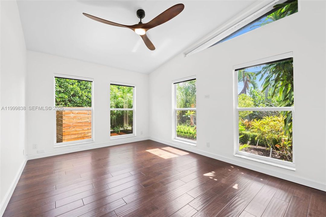 Guest room 2 featuring floor to ceiling windows and custom built out closet cabinetry
