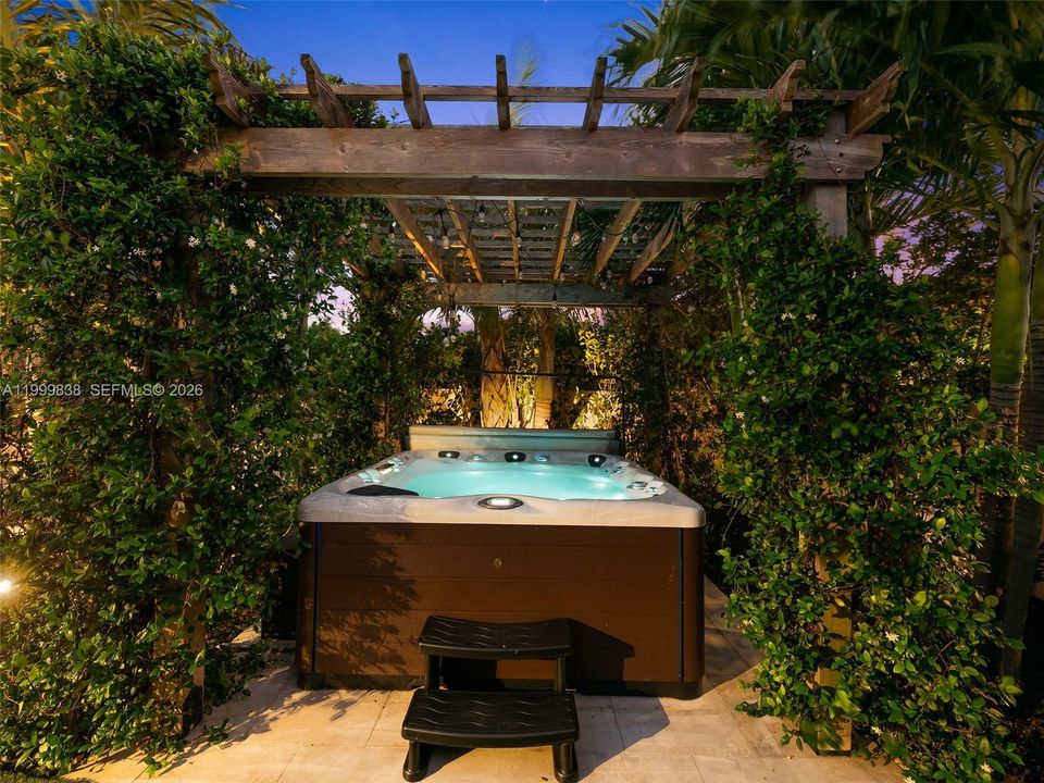 Twilight hot tub in the lushly landscaped gardens