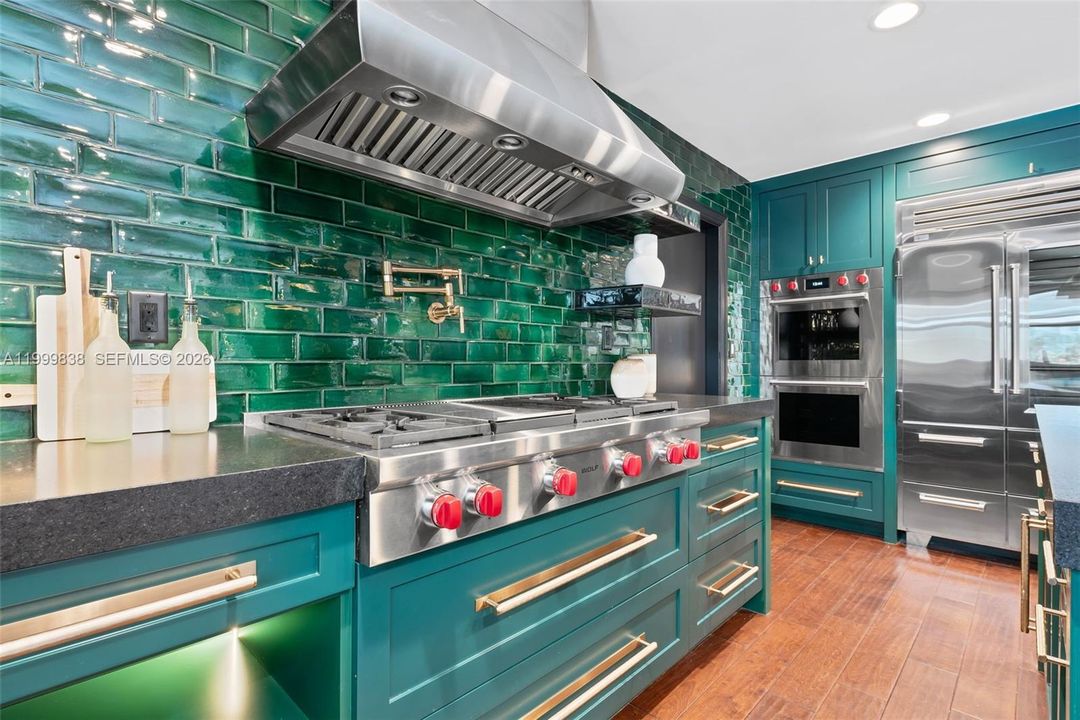 Custom chef's kitchen featuring Wolf gas range, Wolf & Sub Zero appliances