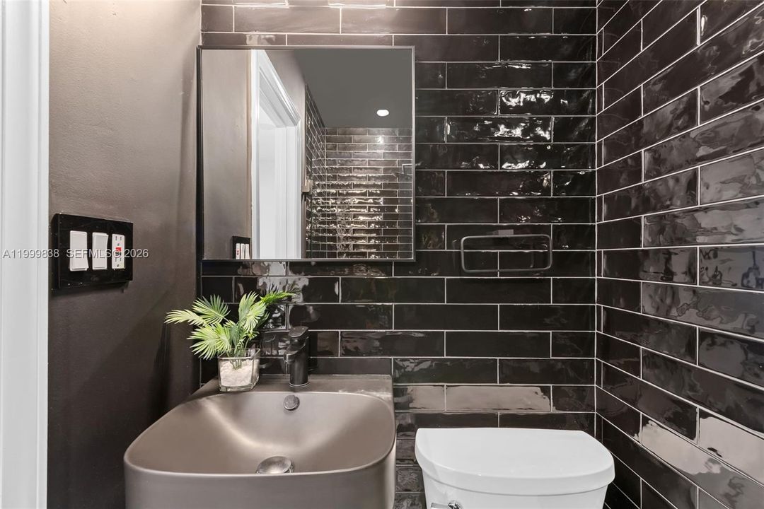 Full guest bath with seamless glass shower enclosure