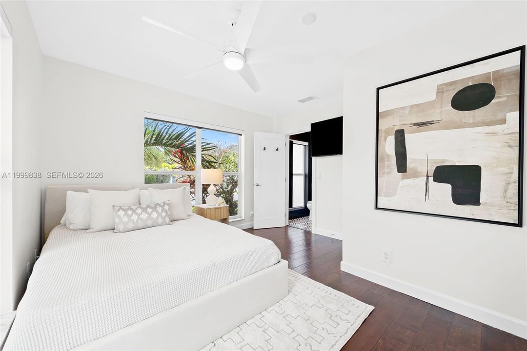 Guest room 1 featuring en suite bath and picture windows