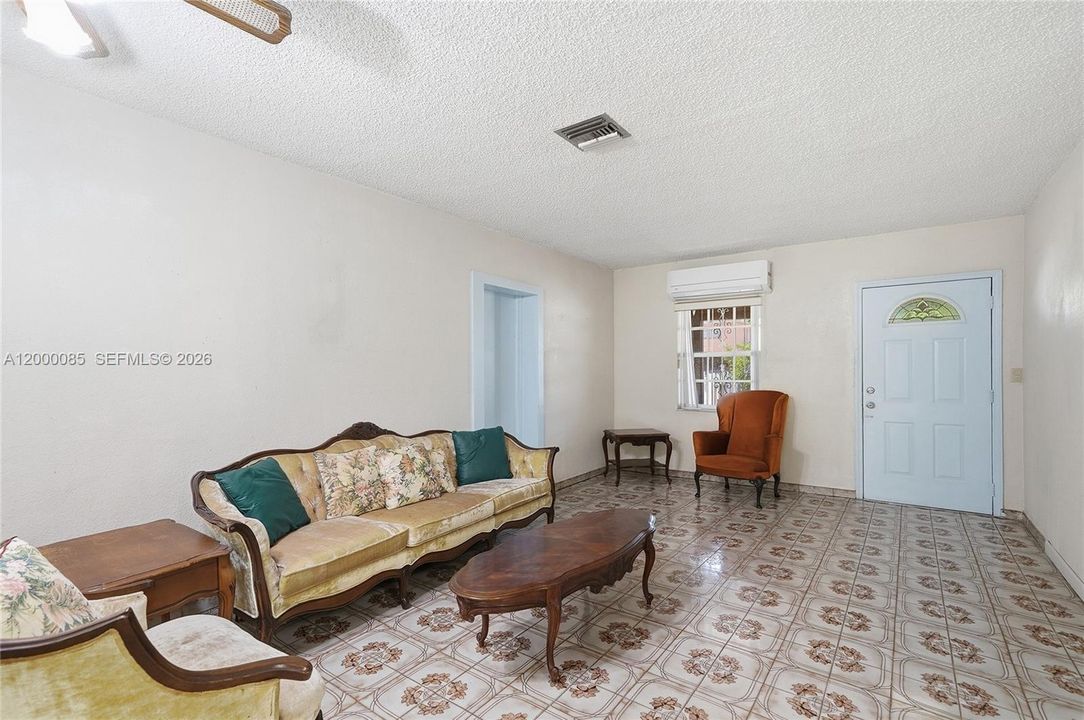 View from dining room looking towards exit door. Attached efficiency is past the door to the left.