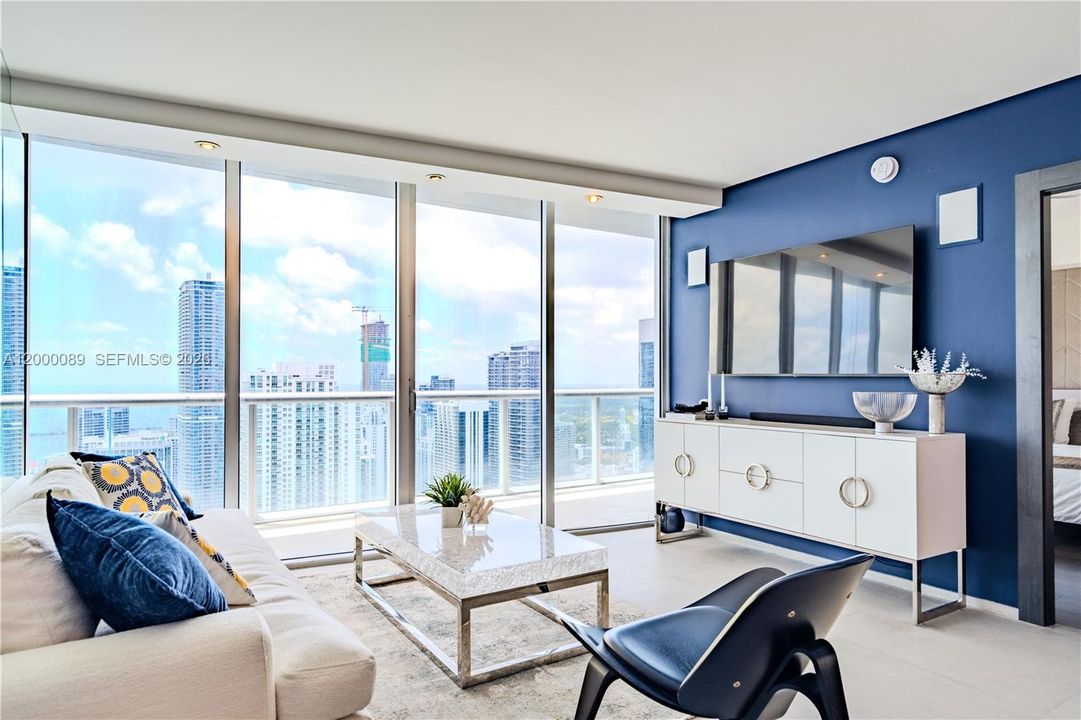 Living room with ocean view, plenty of sunshine to make your heart dance.