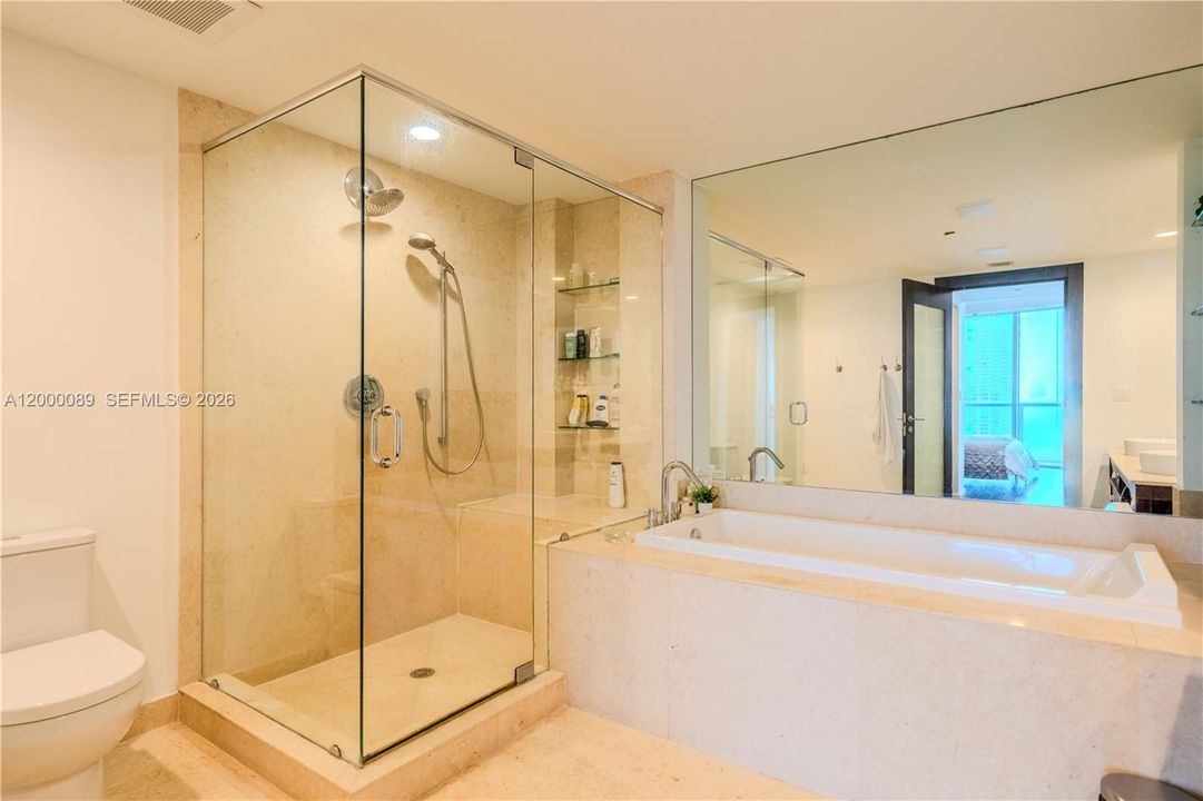 Master Suite bath with a separate standing shower and tub, 2 sinks.