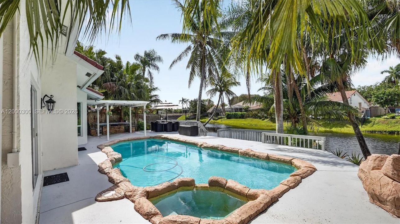 Pool, deck, lake, palm trees
