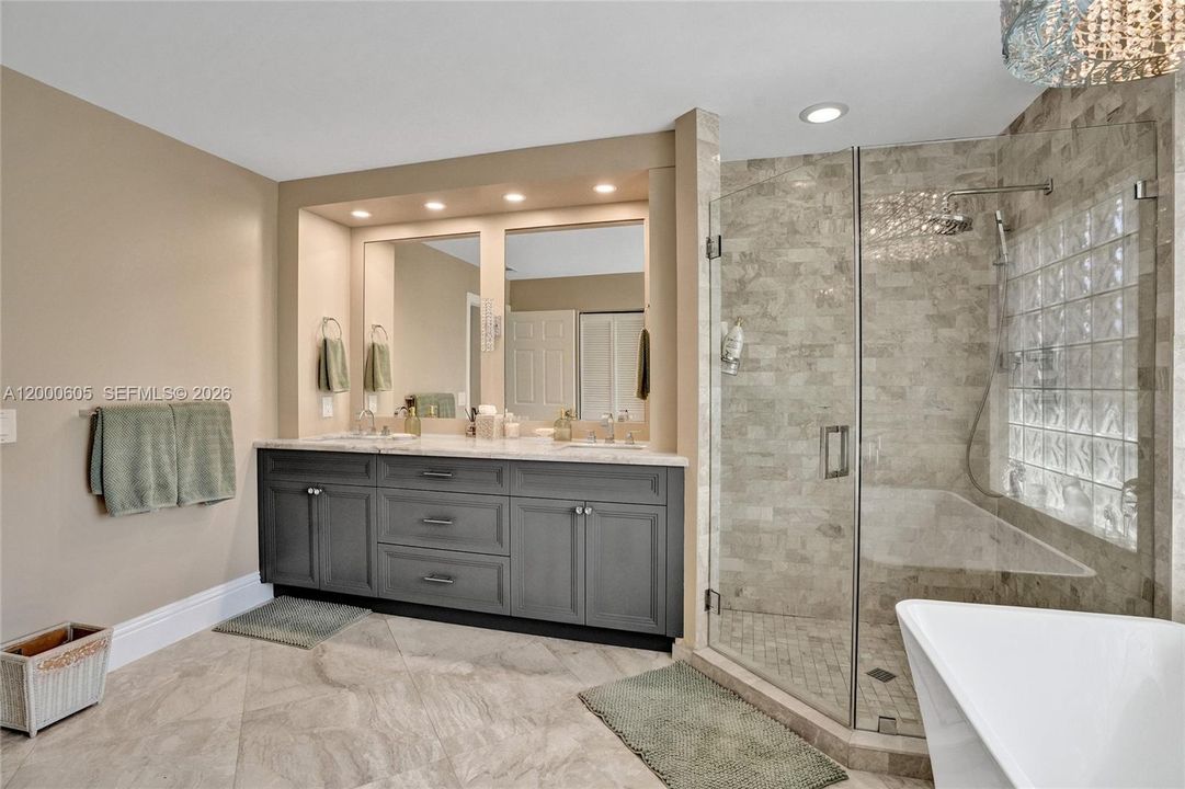 DUAL SINKS, SHOWER WITH UPDATED GLASS AND SOAKING TUB