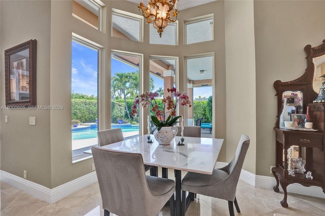 ENJOY YOUR MEAL OVERLOOKING THE POOL AND LANDSCAPING