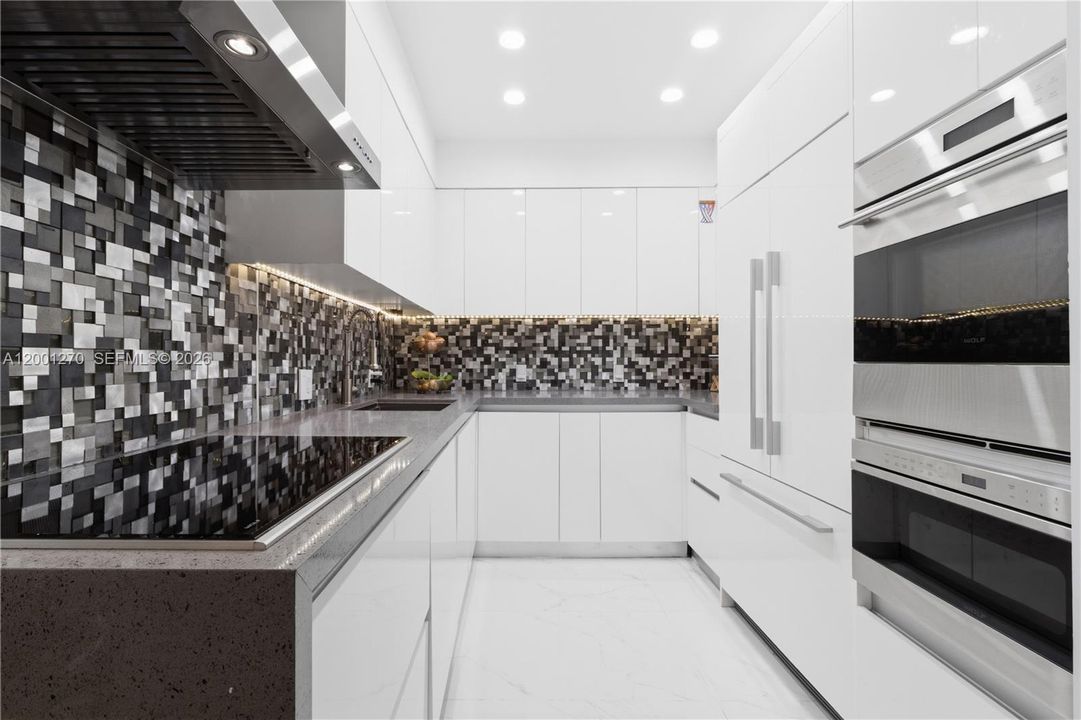 Contemporary kitchen with custom cabinetry and premium appliances