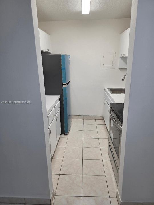 GALLEY KITCHEN AT ENTRANCE OF UNIT