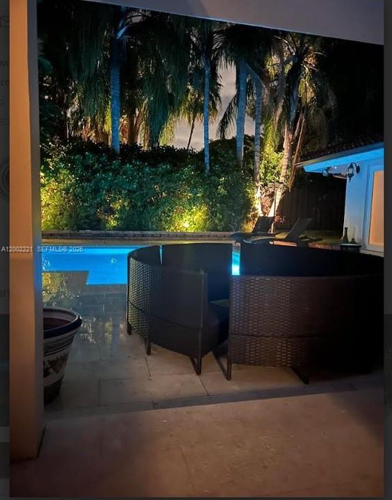 Another nighttime view of the pool from a distance