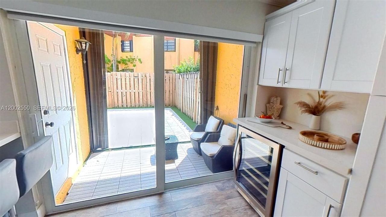 WINE COOKER, EXIT TO COVERED PATIO SEATING AREA
