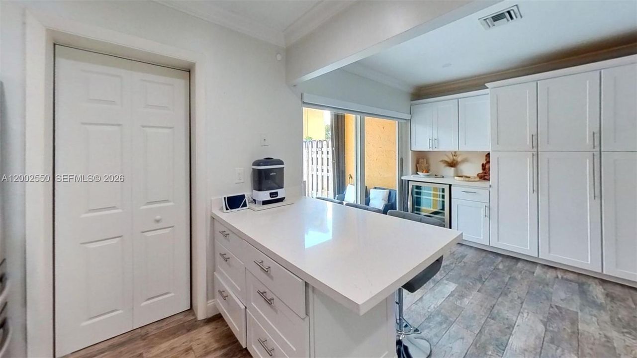 VIEW FROM KITCHEN WITH LAUNDRY ROOM ON LEFT