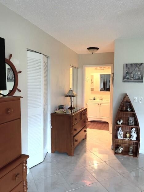 Dual closets and primary bathroom photo