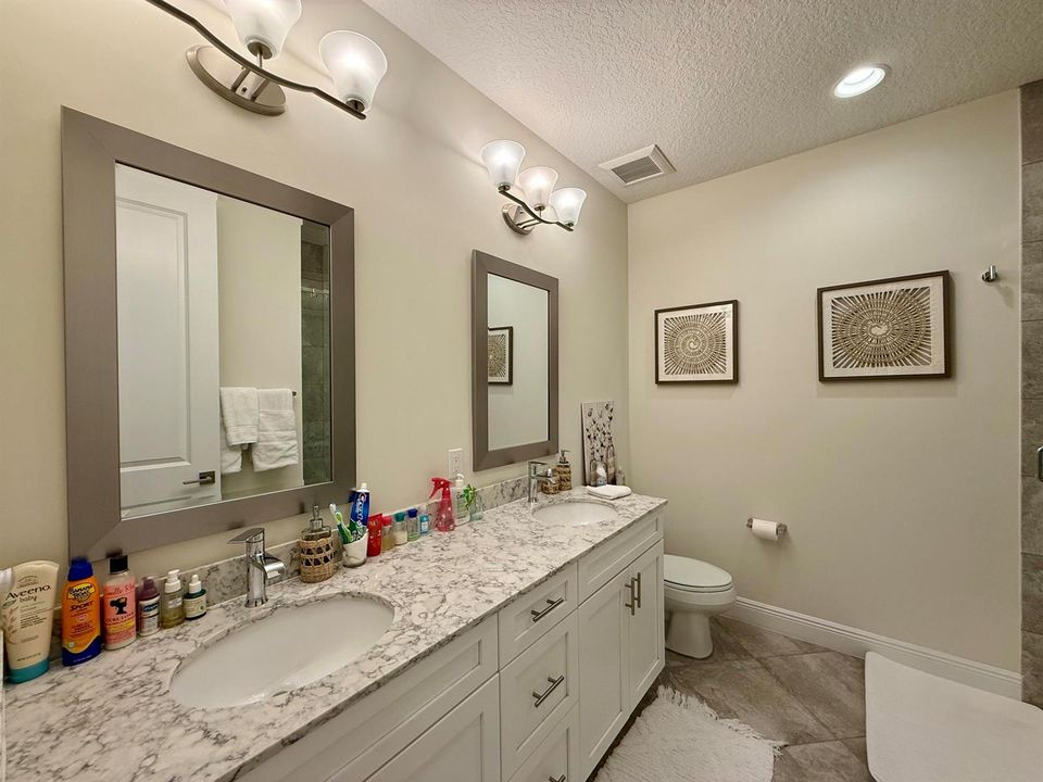 Guest bath featuring dual vanities