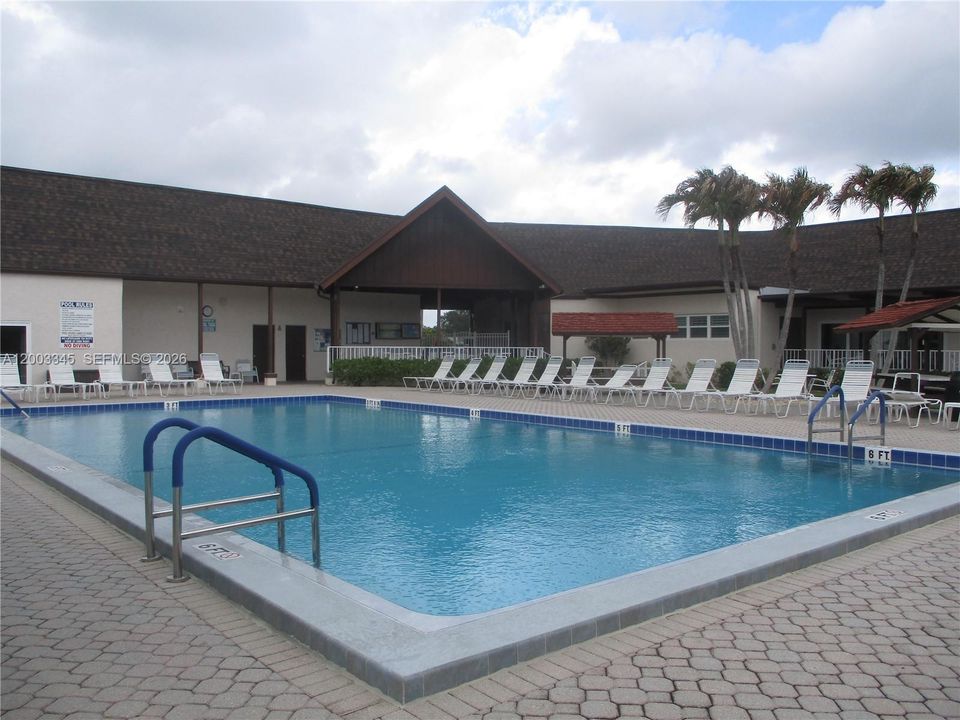 POOL WITH THE RECREATION ROOM TO LEFT, SAUNA & COMMUNITY ROOM TO RIGHT