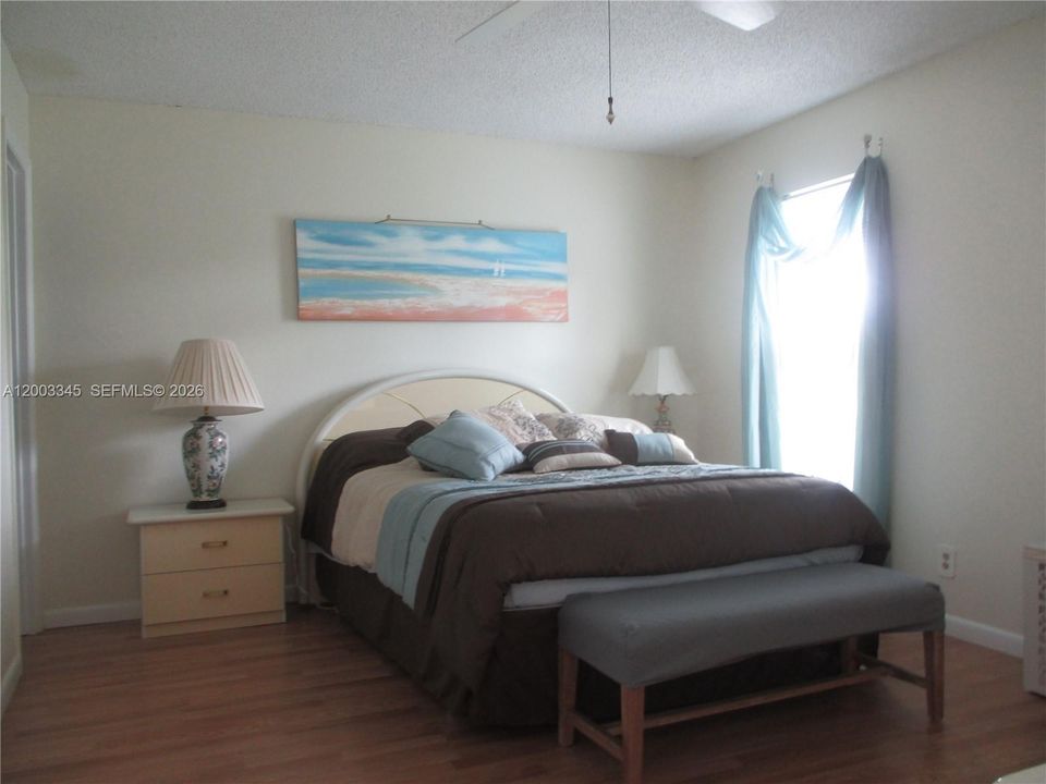 MASTER BEDROOM WITH LAMINATED FLOORING