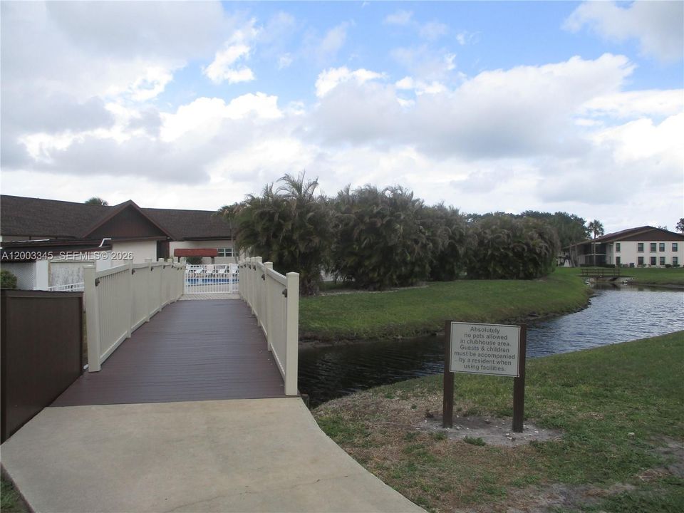 ENTRANCE TO POOL FROM S BLDG.