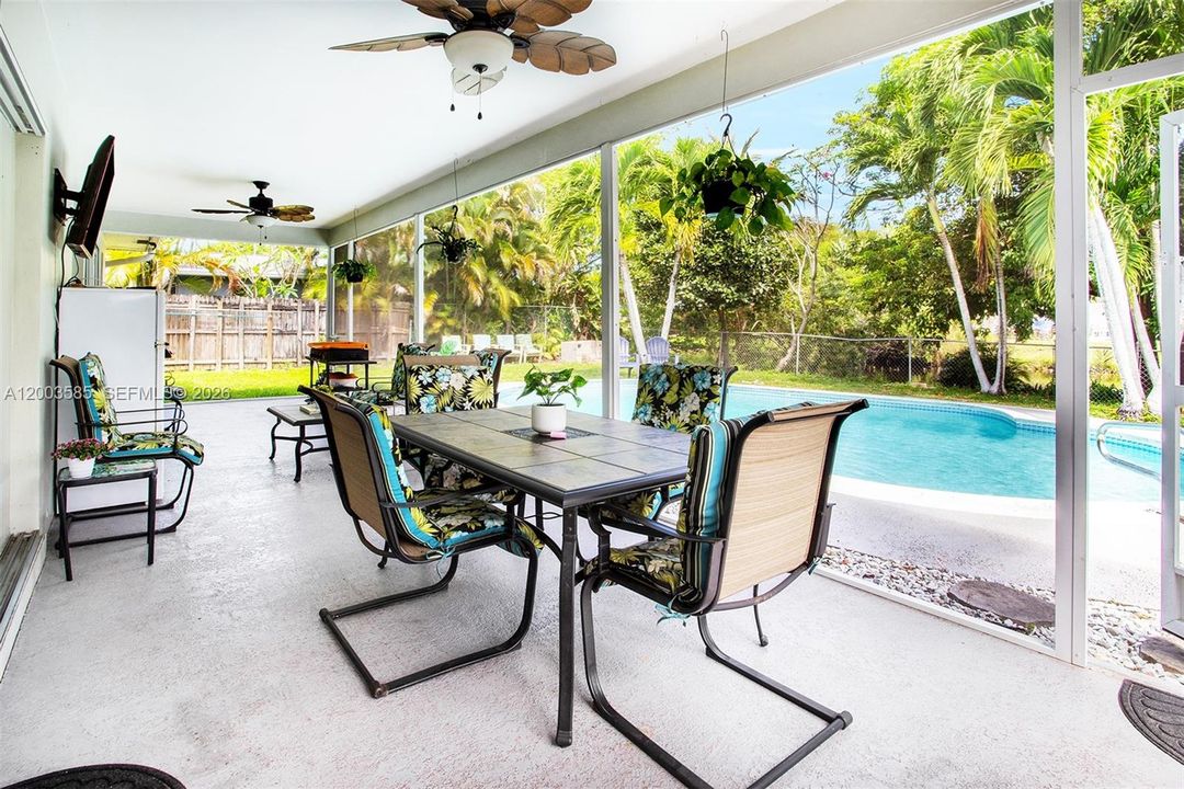 SPACIOUS COVERED AND SCREENED PATIO